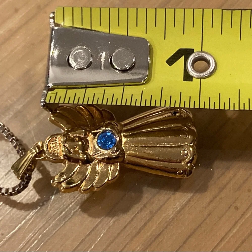 Vintage 90’s Avon Golden Heavenly Angel Pendant/Clip on Earrings. Blue Stone